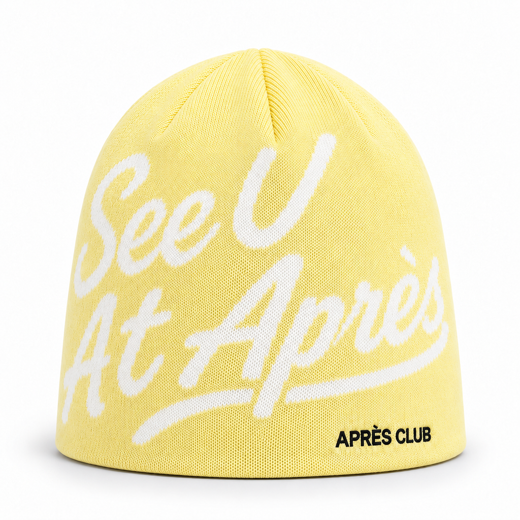Après Club See U At Après beanie in butter yellow, front view with the knitted script